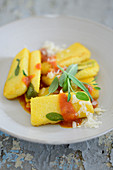 Fried polenta with tomato sauce