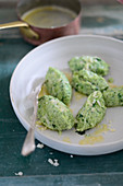 Spinach dumplings with melted butter