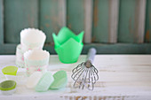 Paper baking cases and a whisk