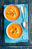 Cream of tomato soup with pink peppercorns