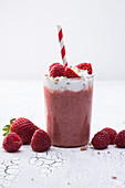 Vegan raspberry and strawberry shake with soya cream