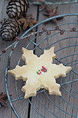 A snowflake biscuit on a cooling rack