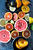 Halved citrus fruits and a juicer