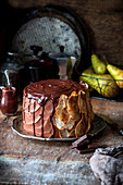 Chocolate cake with blue cheese baked cheesecake layer and pears