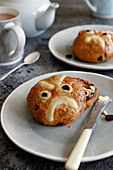 Hand made hot cross buns with a twist, with a decorative angry face