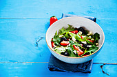 Rocket salad with strawberries, blackberries and feta cheese