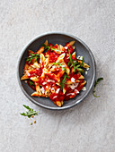 Penne with tomato sauce, rocket and green pepper