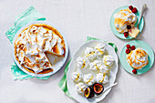Lemon meringue tart, meringues with passion fruit cream, baked ice cream bombs with raspberries