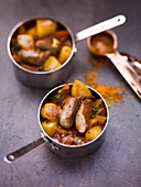 Nuremberg sausage goulash in small pans