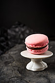 A raspberries macaroon with a chocolate filling