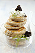 Blinis with goat's cheese and caviar