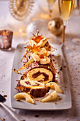 Yule log with pears and caramel for Christmas