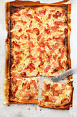 Tarte flambée with onion and bacon topping