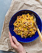 Red lentil fusilli with carrot and turmeric cream and cashew nuts