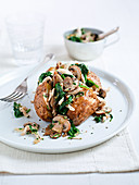 Baked potato with chicken, mushrooms and spinach