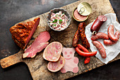 Still life of various sausages on a kitchen board