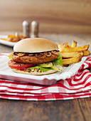 A lentil and chickpea burger with chips
