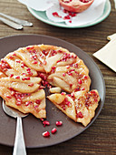 Crumble and quince tart with pomegranate seeds