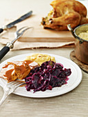 Crispy duck with red cabbage and apple and olives