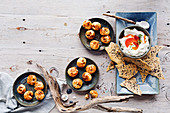 Chorizo and manchego gougeres and yoghurt dip with chilli oil