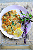 A breaded parasol mushroom escalope with red basil
