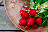 Radish on a wooden plate