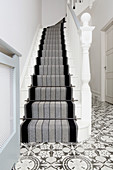Striped stair runner on classic staircase
