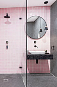 Pink bathroom with shower area and black details