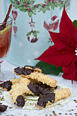 Piped biscuits, mulled wine, a tin and a poinsettia