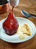 Tipsy red wine pear with sabayon and caramel ice cream