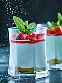 Strawberries and quark with mint in glasses