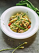 Spirelli pasta with Thuringian sausage and green asparagus
