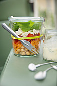 Rainbow salad with feta cheese in a jar