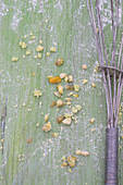 Chopped pistachios on a green baking board