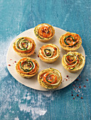 Mini chickpea cakes with vegetable spirals