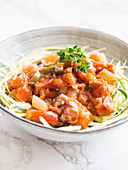 Vegan raw zucchini pasta with vegetable sauce