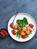 Fried salmon with broccolini and tomato chutney