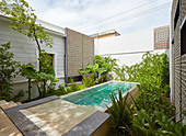 Long pool in courtyard of exotic house