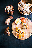 An arrangement of mushrooms with chanterelles and porcini mushrooms