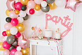 DIY balloon garland in party room