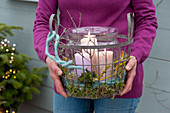 Woman brings basket with lantern