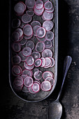 Sliced radishes in tray