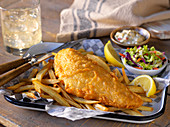 Cod in batter with French fries and salad