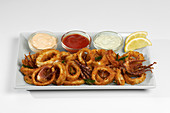 Breaded squid rings with different dips