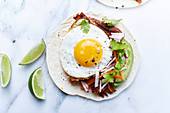 Pulled pork tacos with a fried egg