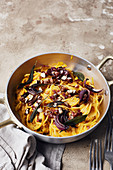 Pumpkin carbonara with red onions