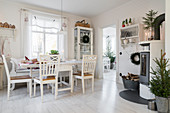 Table and chairs in festively decorated kitchen-dining room