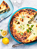 Puff pastry quiche with spinach, dried tomatoes and feta cheese