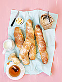 Homemade baguettes served with tea (top view)