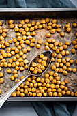 Spicy roasted chickpeas on a baking tray